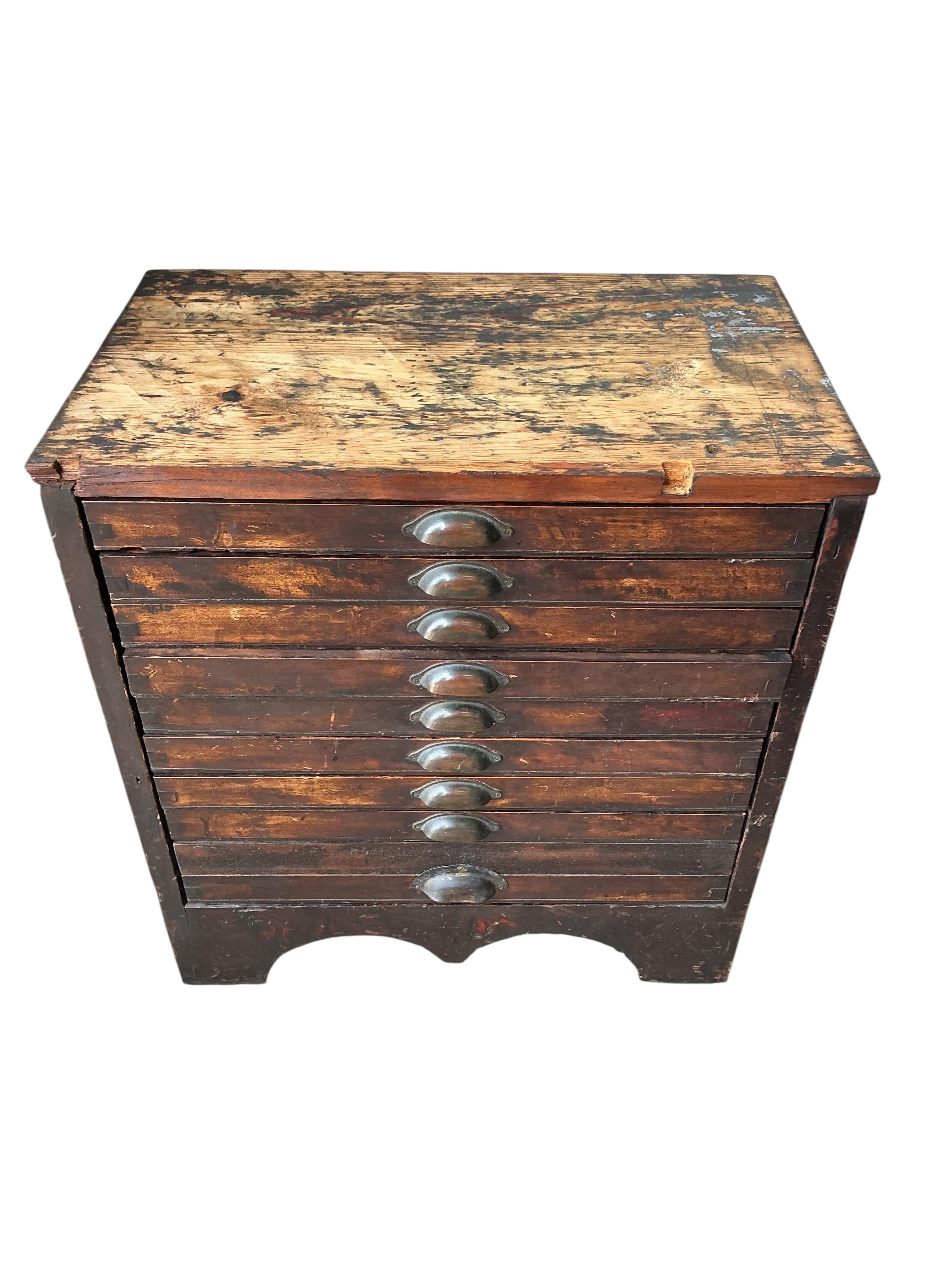 A Victorian cast iron Albion printing press by Wood and Sherwood, Aldersgate Street, London, width 87cm, height 105cm, together with a stained pine chest of print making accessories. Provenance: This was the property of